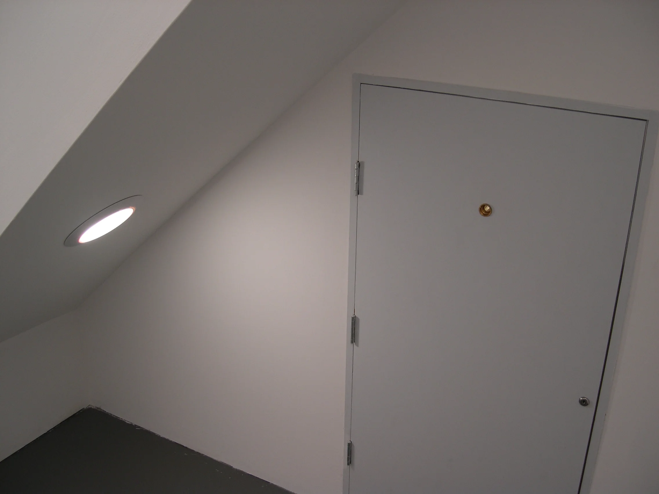   The Palace at 4 AM , installation view of small door under  Attic  stairs crawlspace- height of door: 39 inches. 