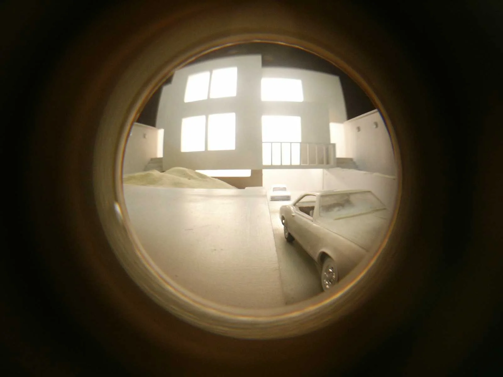 The Palace at 4 AM , interior view Materials include: MDF, wood, polystyrene, Plexiglas, sand, felt, halogen lights, and peephole lens
