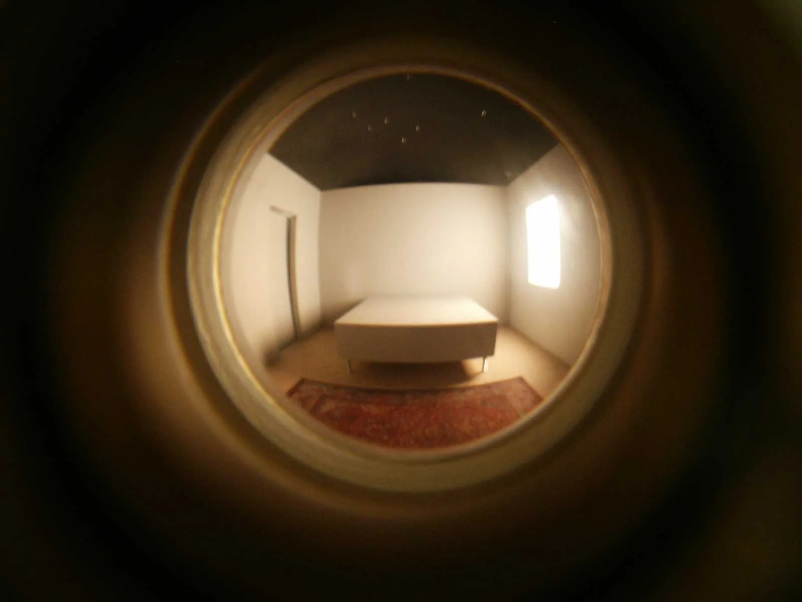 The Palace at 4 AM , interior view of Bedroom Materials include: MDF, wood, aluminum, cloth, Plexiglas, 25 RPM satellite dish motor, foam core, halogen lights, sound (looped recording), and peephole lens