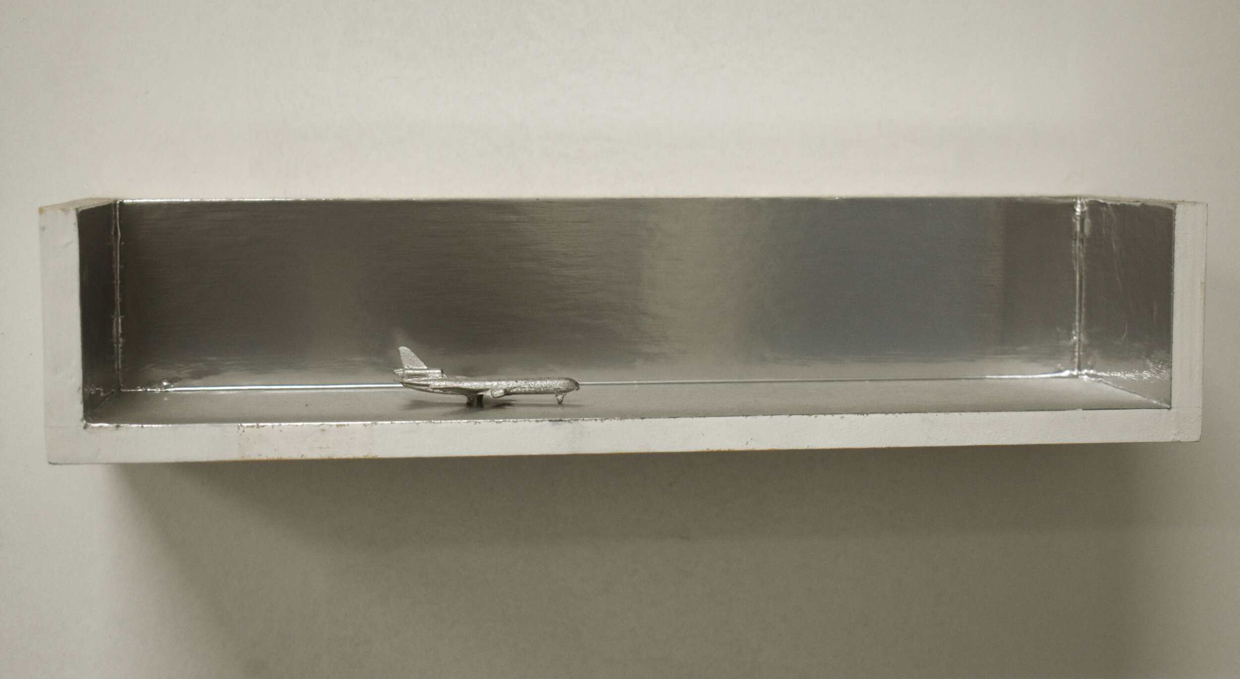    The Flight  , acrylic and enamel on wood, with aluminum and lead, 4 x 2 ¾ x 12 ½ inches, 2018 