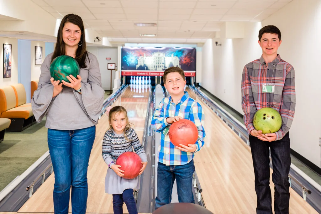 Kids with bowling balls at the White House bowling alley.