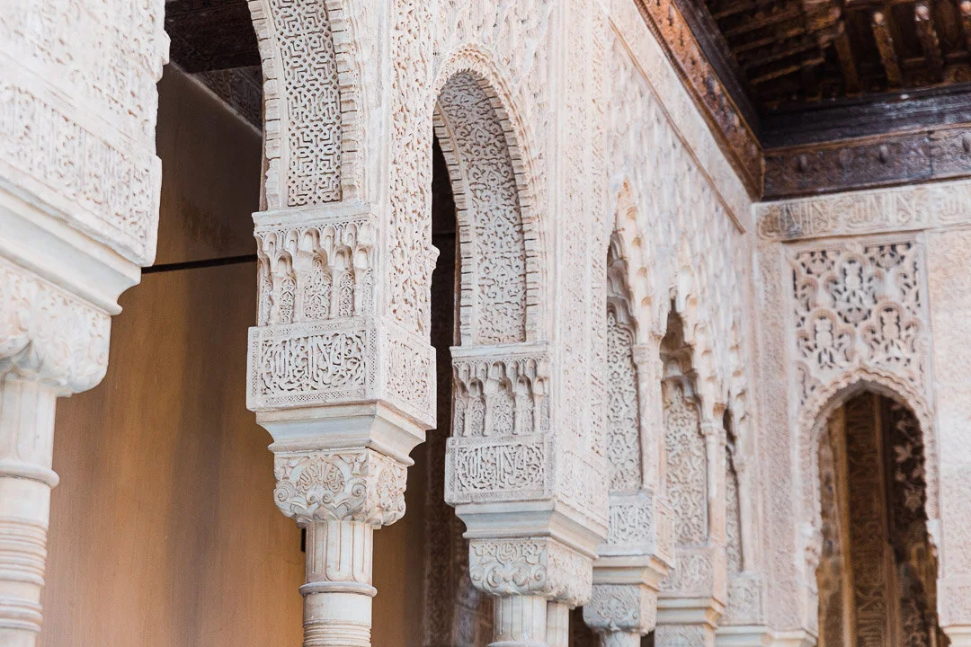 Details carved into the arches of the Nasrid Palaces at the Alhambra Palace in Granada, Spain.