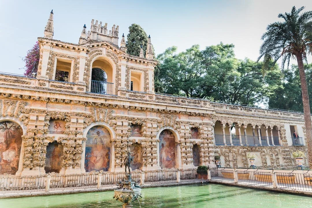 Fountain and outdoor porticos at the Reál Alcazar in Seville, Spain.