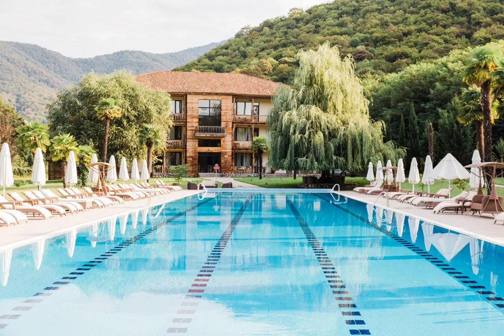 Empty swimming pool and poolside loungers at Lopota Lake Resort.
