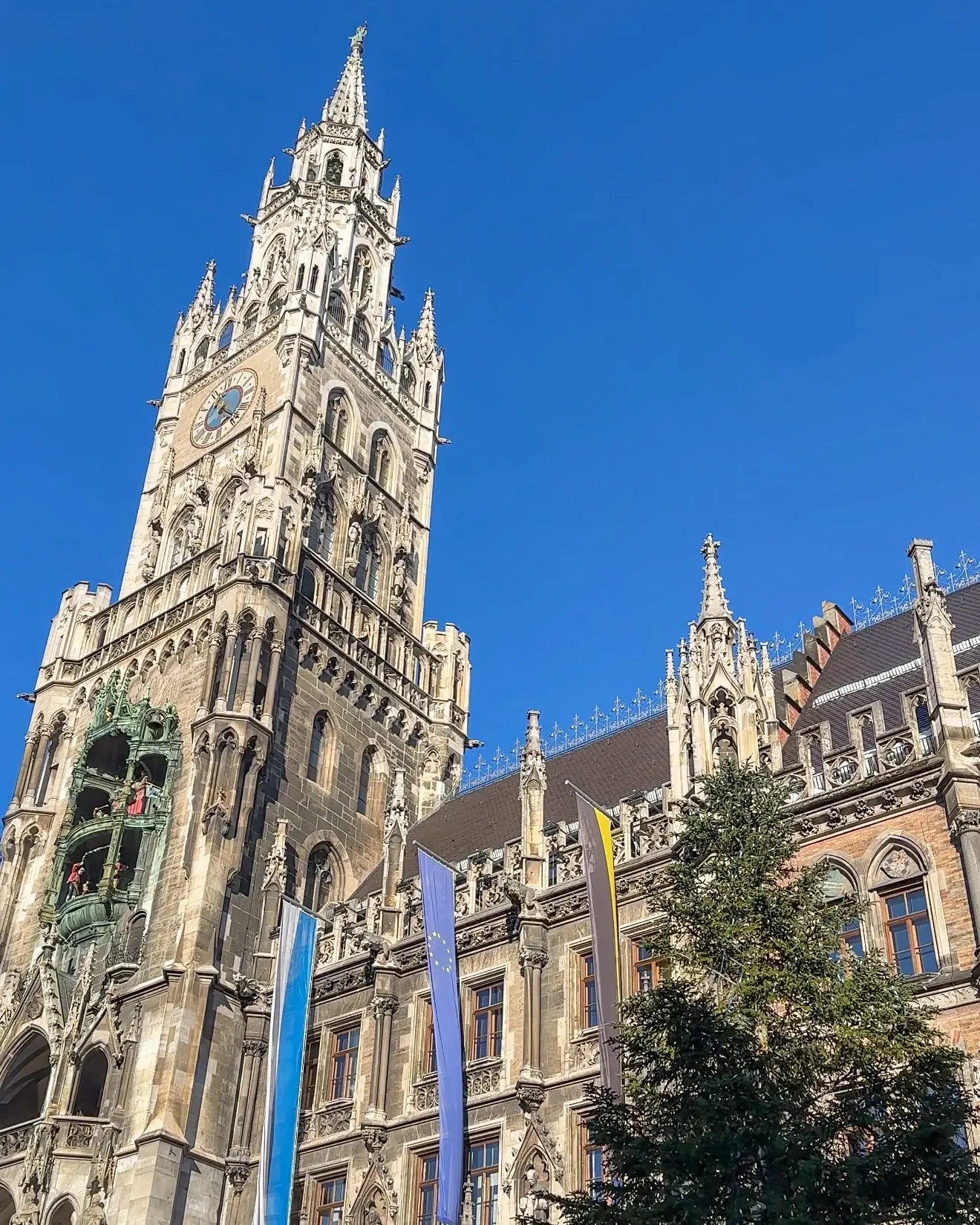 The rathaus tower and top of the Christmas tree at Munich Christmas market