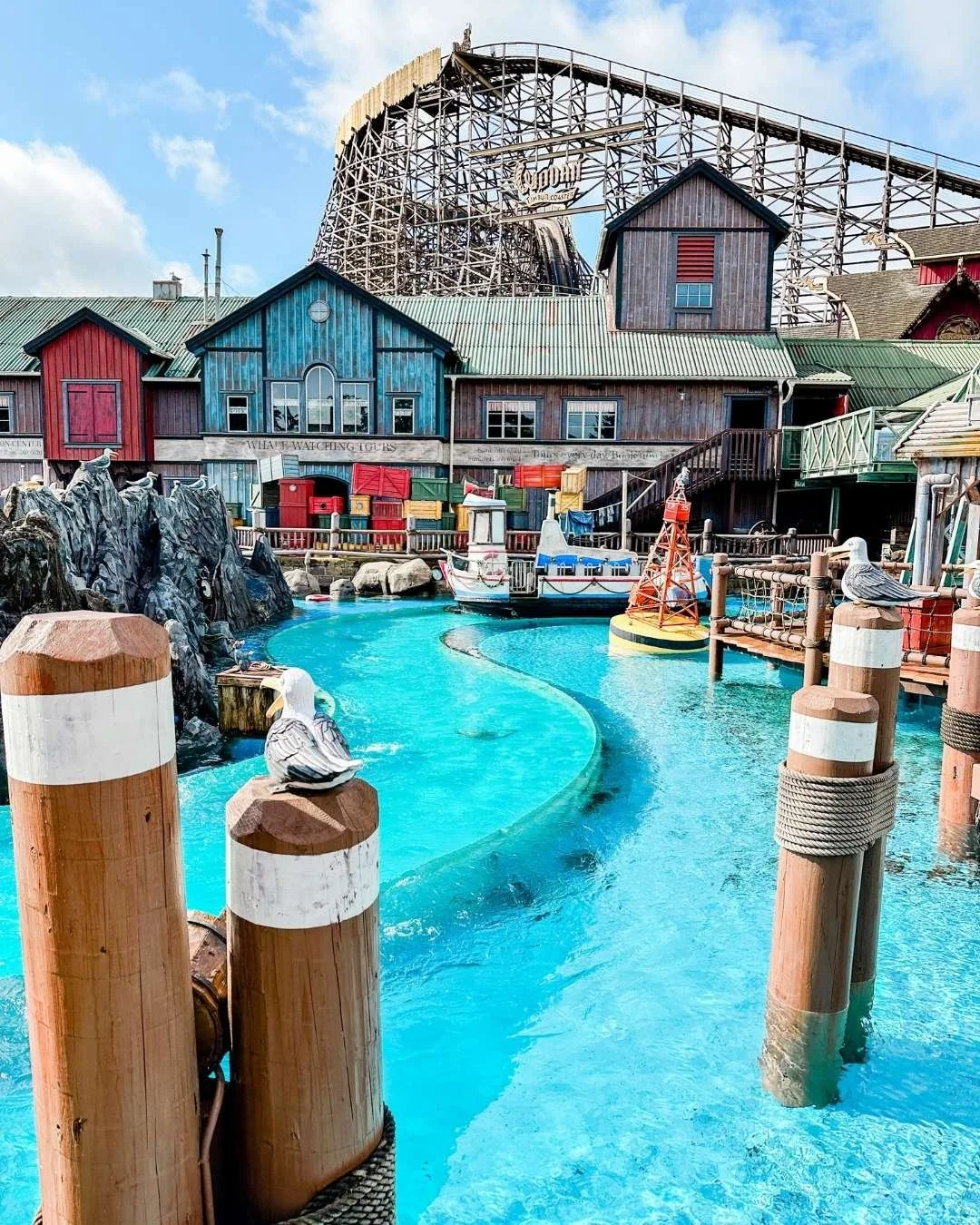 Whale boat ride with large roller coaster in the background at Europa Park, Germany