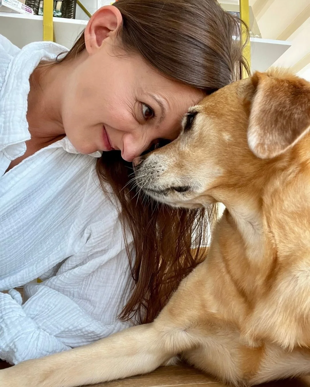 Woman face to face with her dog.