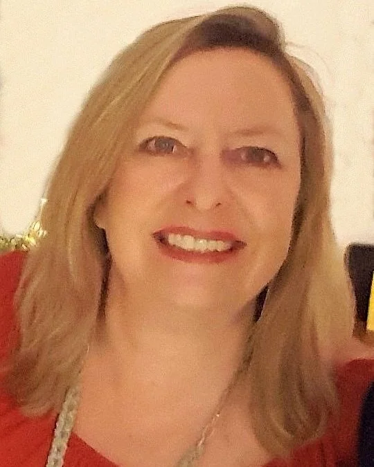 Close up headshot of blonde woman, Phoebe a lifelong expat in France