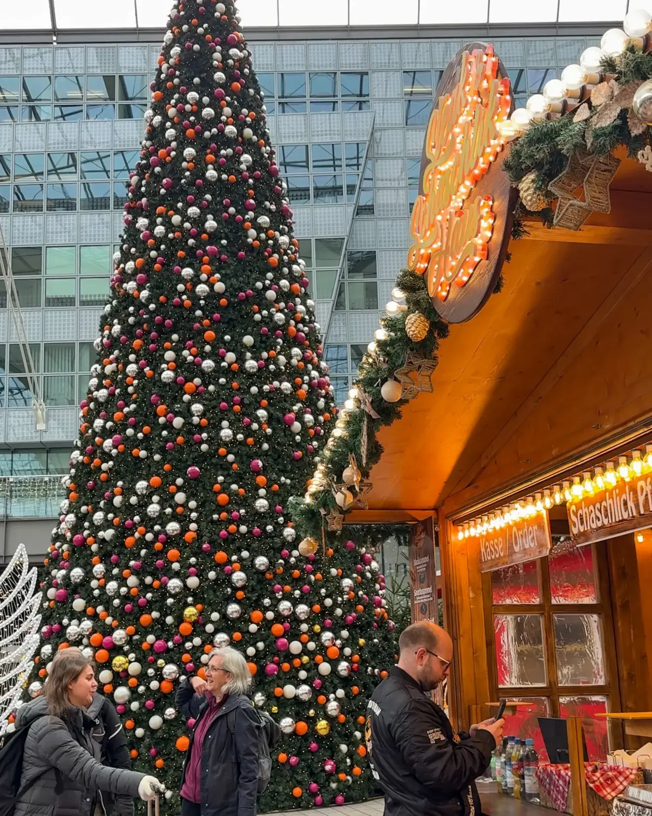 Christmas tree and food booth at the Munich Christmas market