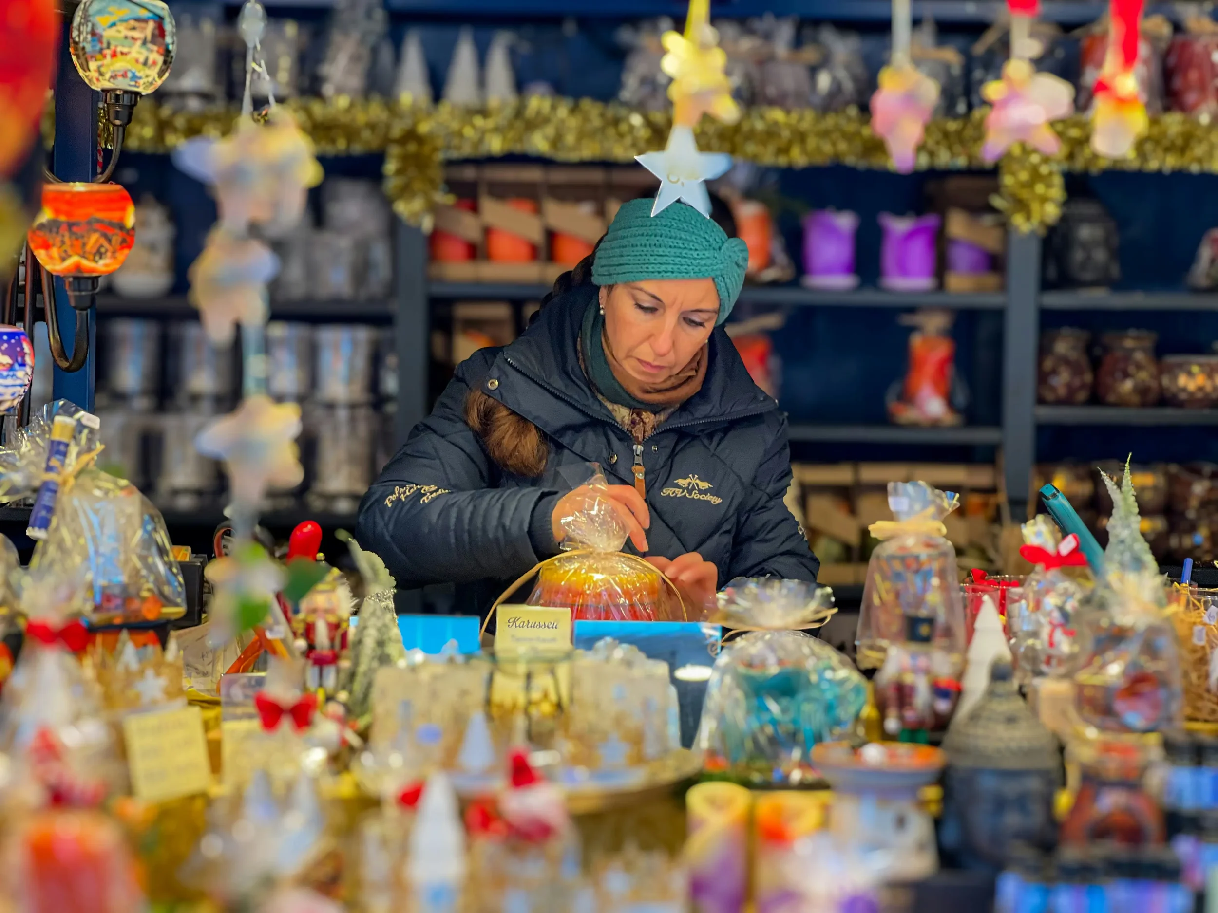 Woman vendor at a Christmas market booth