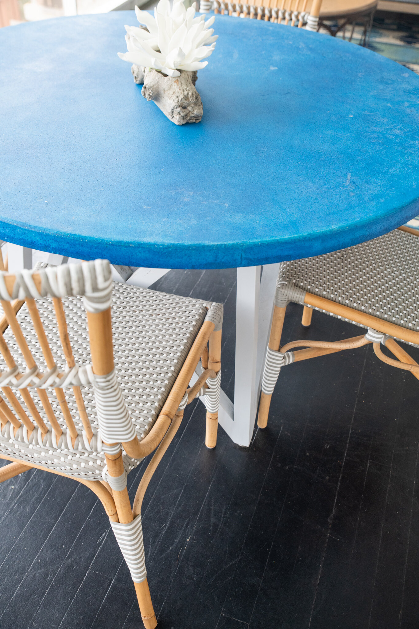 Dwell-Chic-Colorful-Coastal-Porch-Blue-Table-And-Bamboo-Chair-Details.jpg
