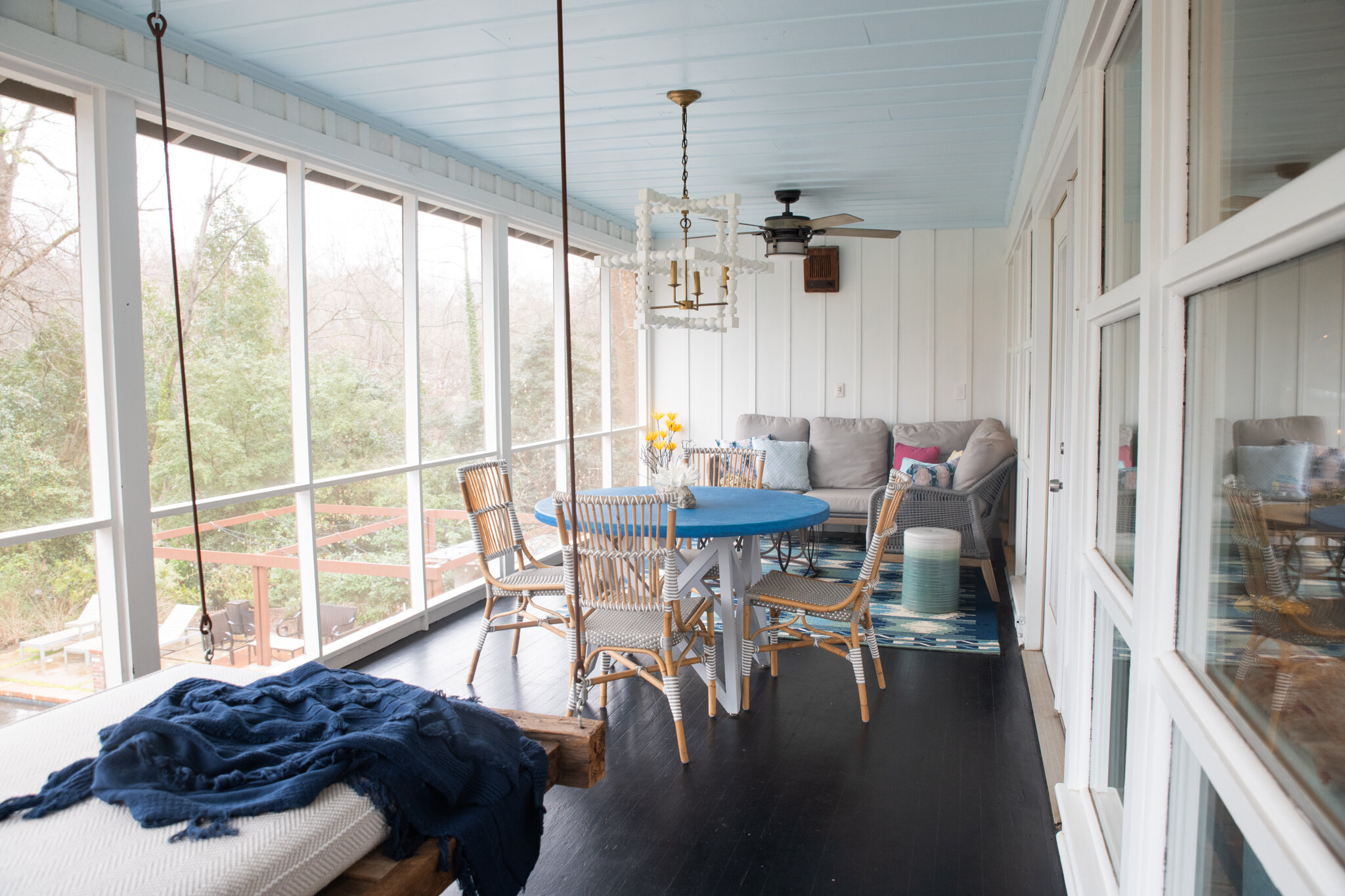 Dwell-Chic-Colorful-Coastal-Porch-Lounge-Swing-And-Table.jpg