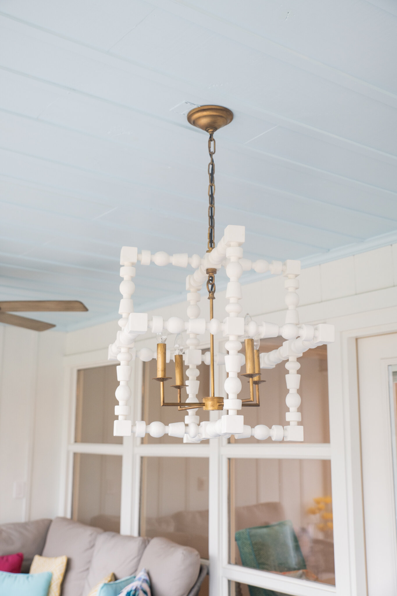 Dwell-Chic-Colorful-Coastal-Porch-White-Outdoor-Chandelier.jpg