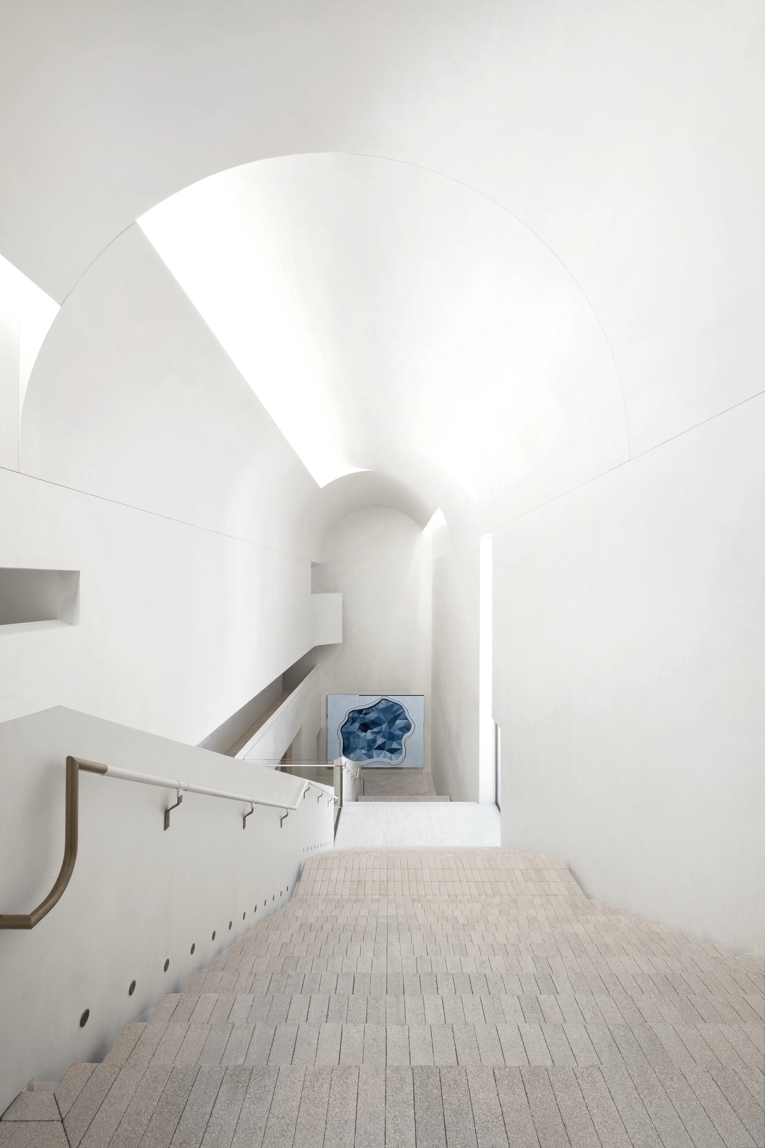 Indigo Slam’s brick staircase under a barrel-vaulted ceiling. Photo: David Roche