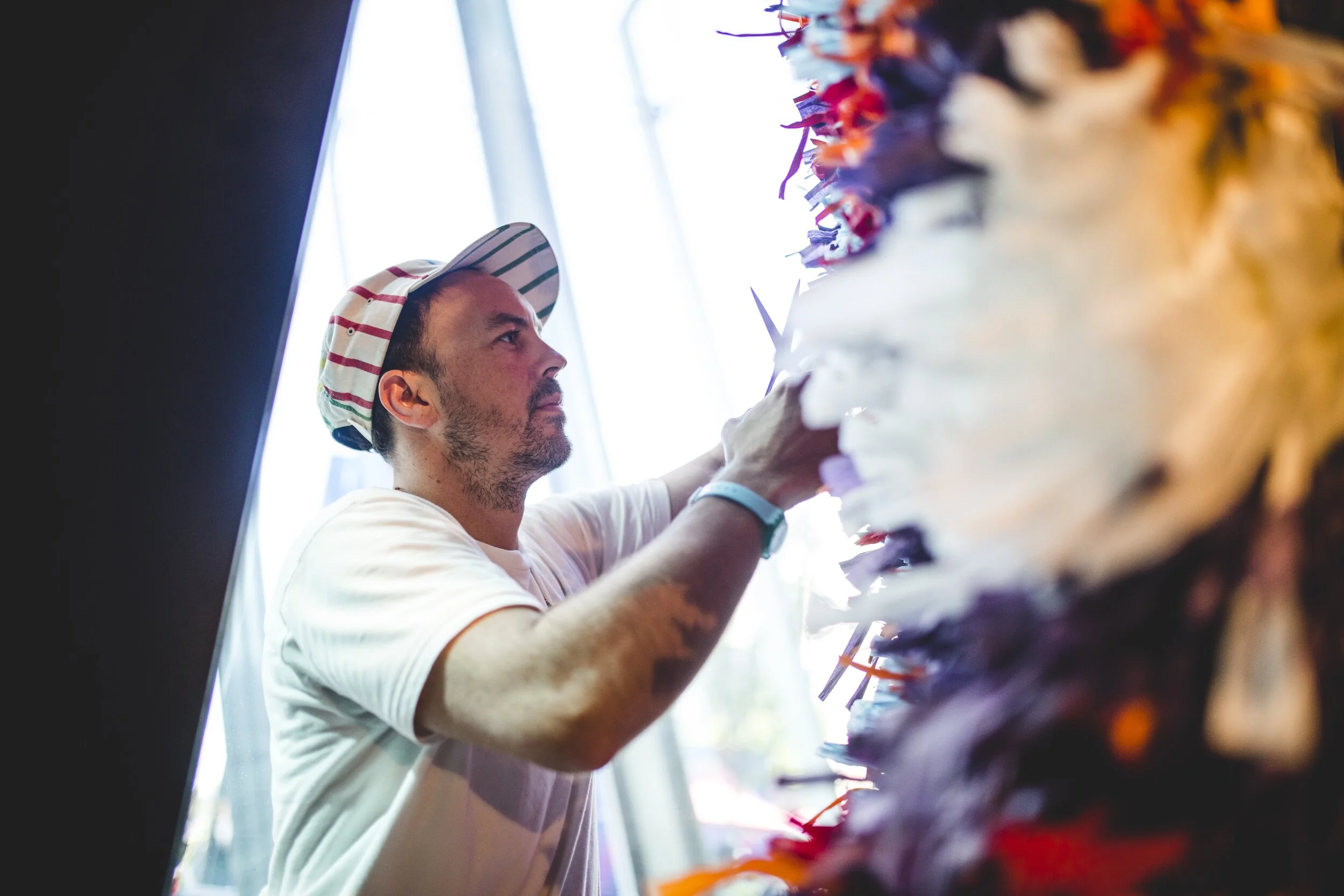 Benja Harney working on Sydney installation – The Streets of Barangaroo. Photo: Billy Zammit