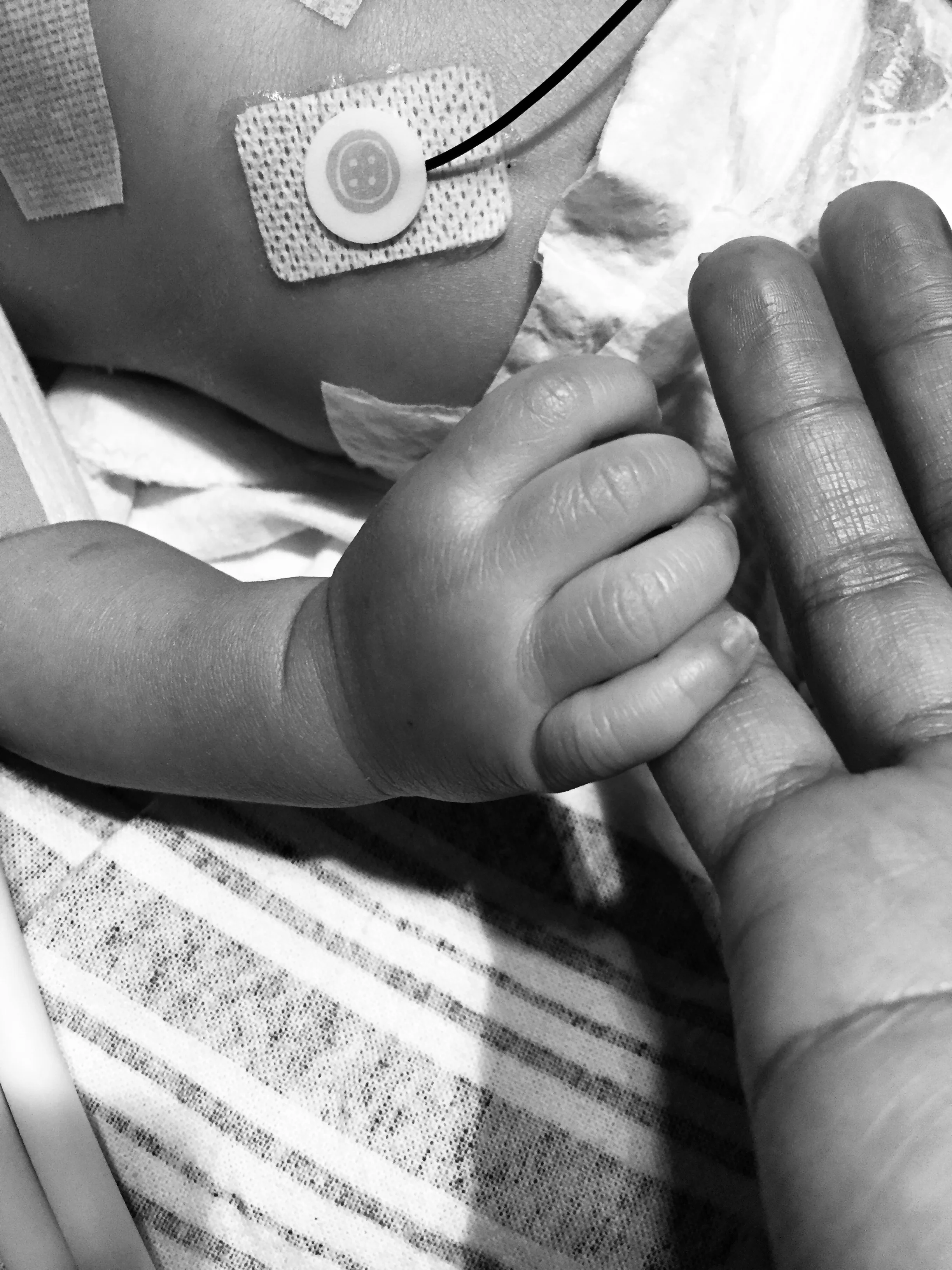 parent-holding-babys-hand_t20_eJ67P7.jpg