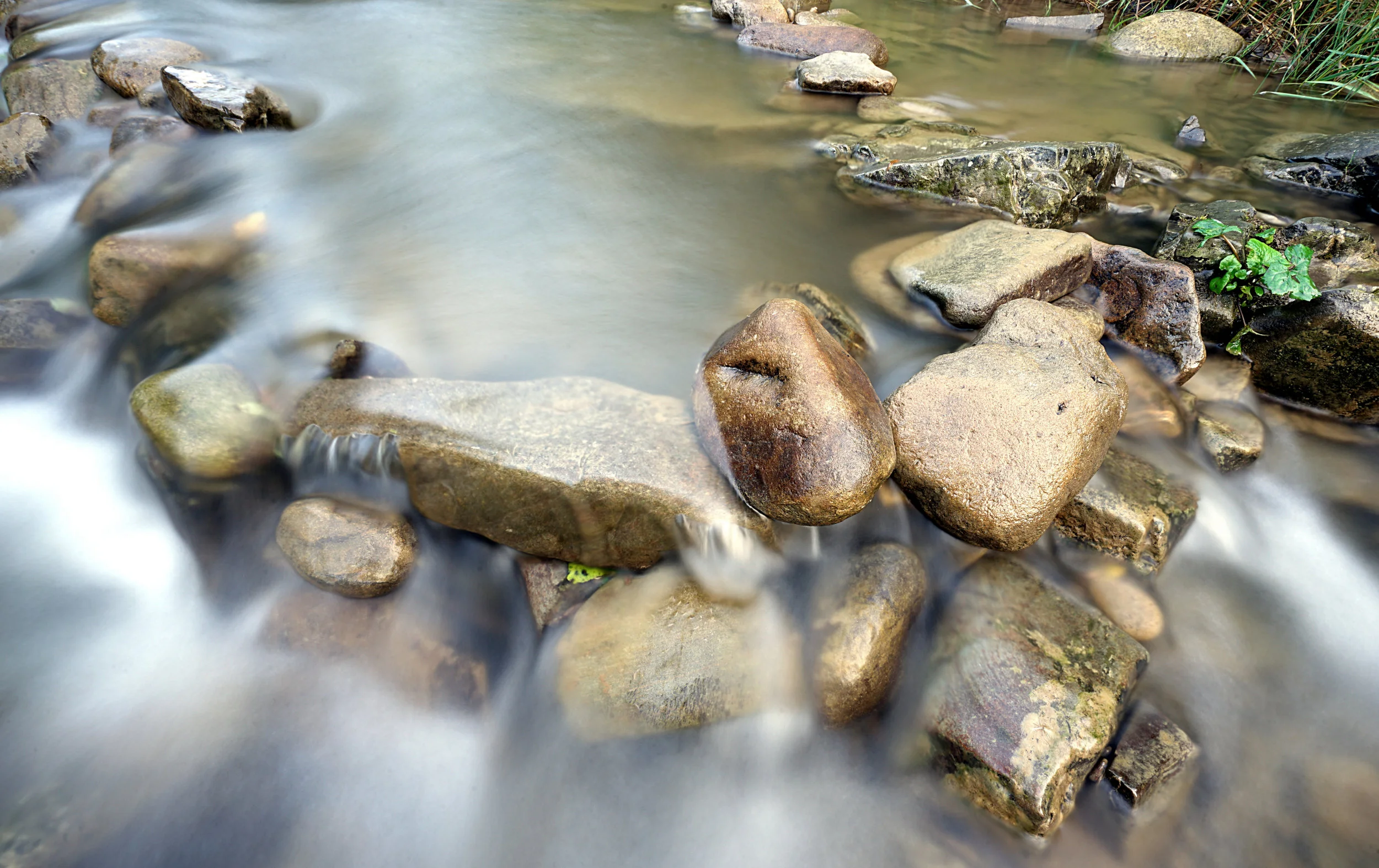 stock-photo-stones-in-the-river-277848759.jpg