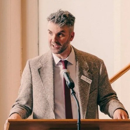 Photo of a speaker at a podium