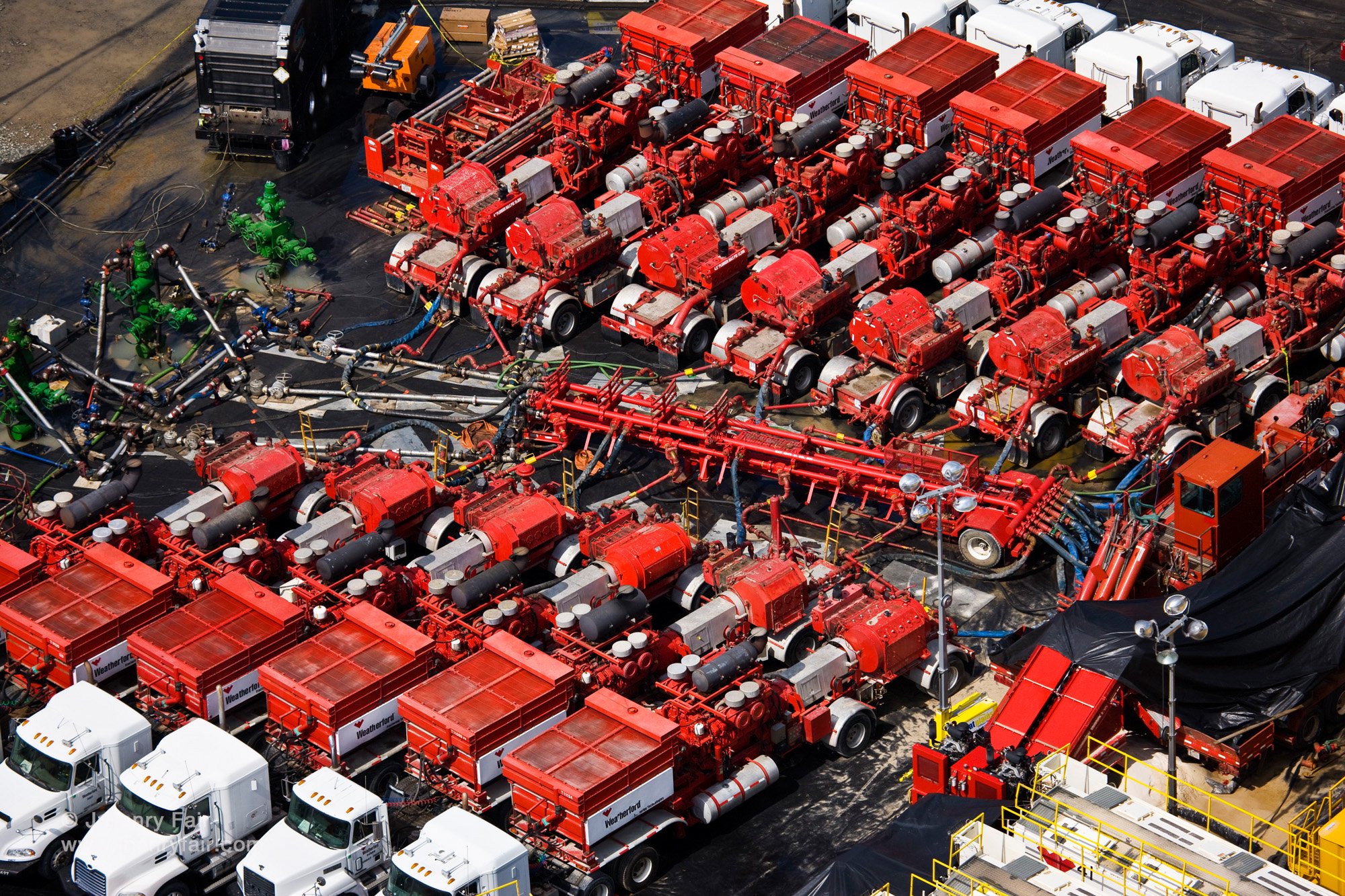  The actual process of hydro-fracking involves arraying numerous compressors around a well head manifold (seen in green in the top left) and pressurizing the system with millions of gallons of fresh water (depleting local groundwater or river water) 