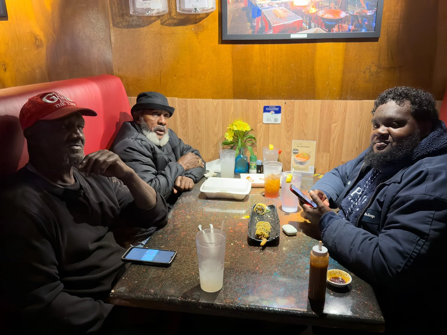  men at restaurant table 