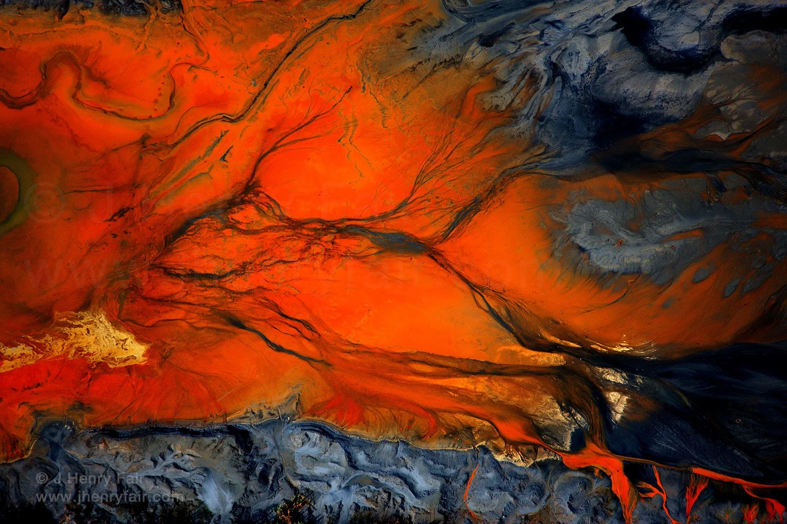 The title of this piece of art is "Arsenic" because it is a photo of a coal ash dump leaching arsenic into a pristine river from which CHarleston gets its drinking water.
This toxic time bomb is a perfect example of why we need stringent ru