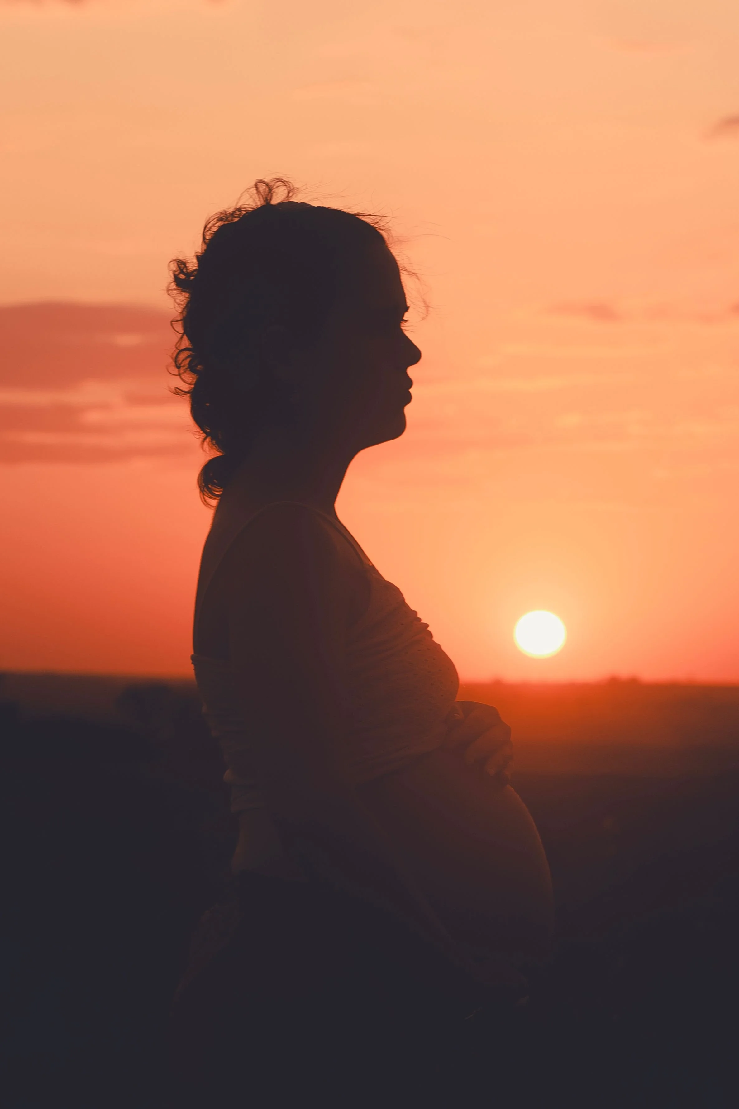 pregnant mom holding her belly