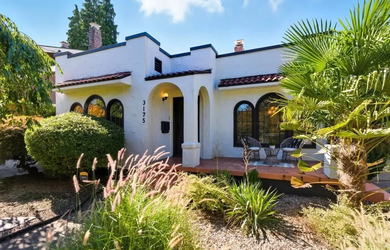 This Mission-style bungalow in the heart of Alameda feels like a slice of sunshine, featuring two sets of beautiful triple arch windows (which, if you're feeling *fancy*, are technically called Palladian windows after 16th-century Italian architect A
