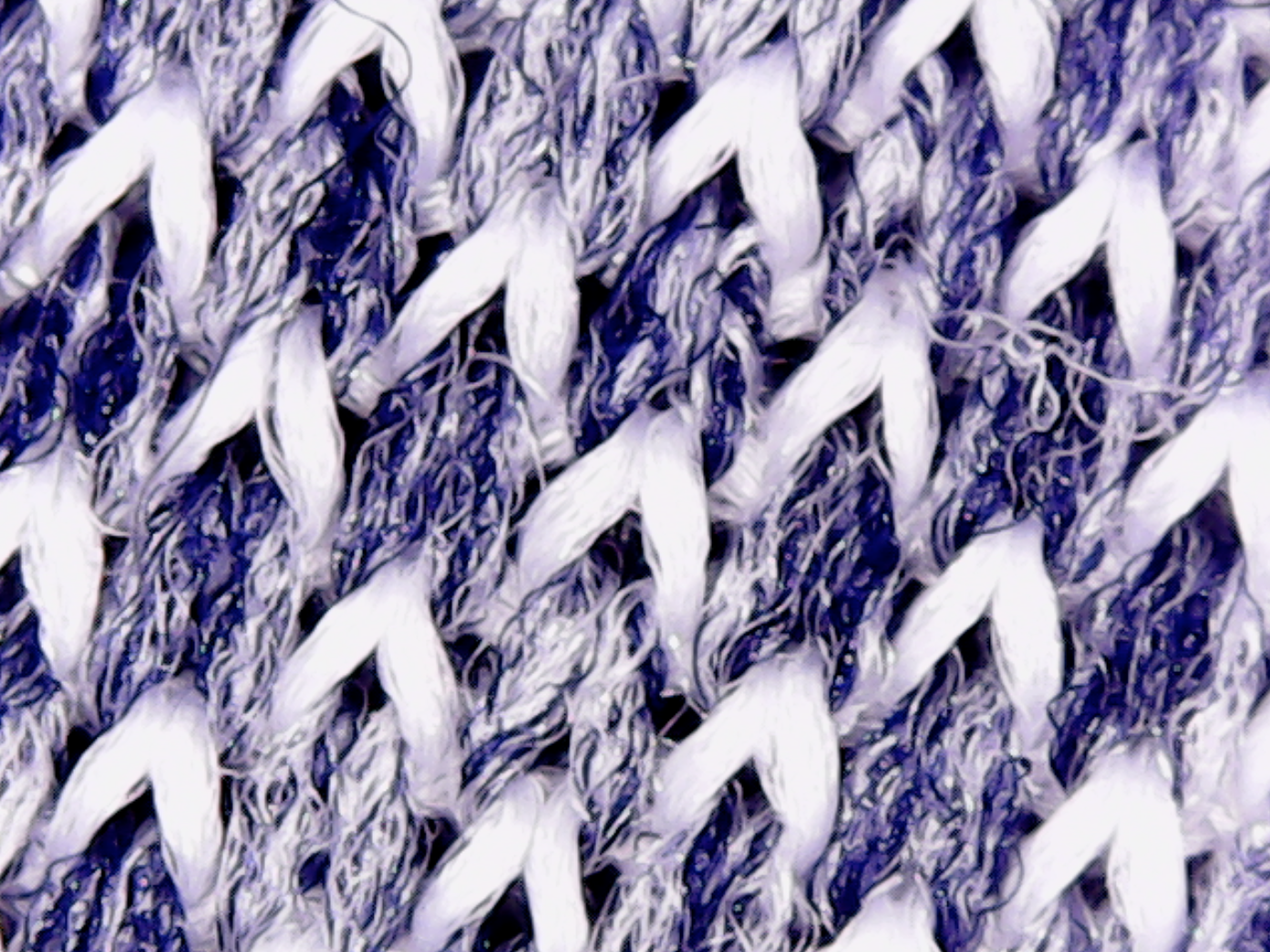 The Apollo fabric at 1000x magnification reveals its subtle porosity allowing air to flow through.