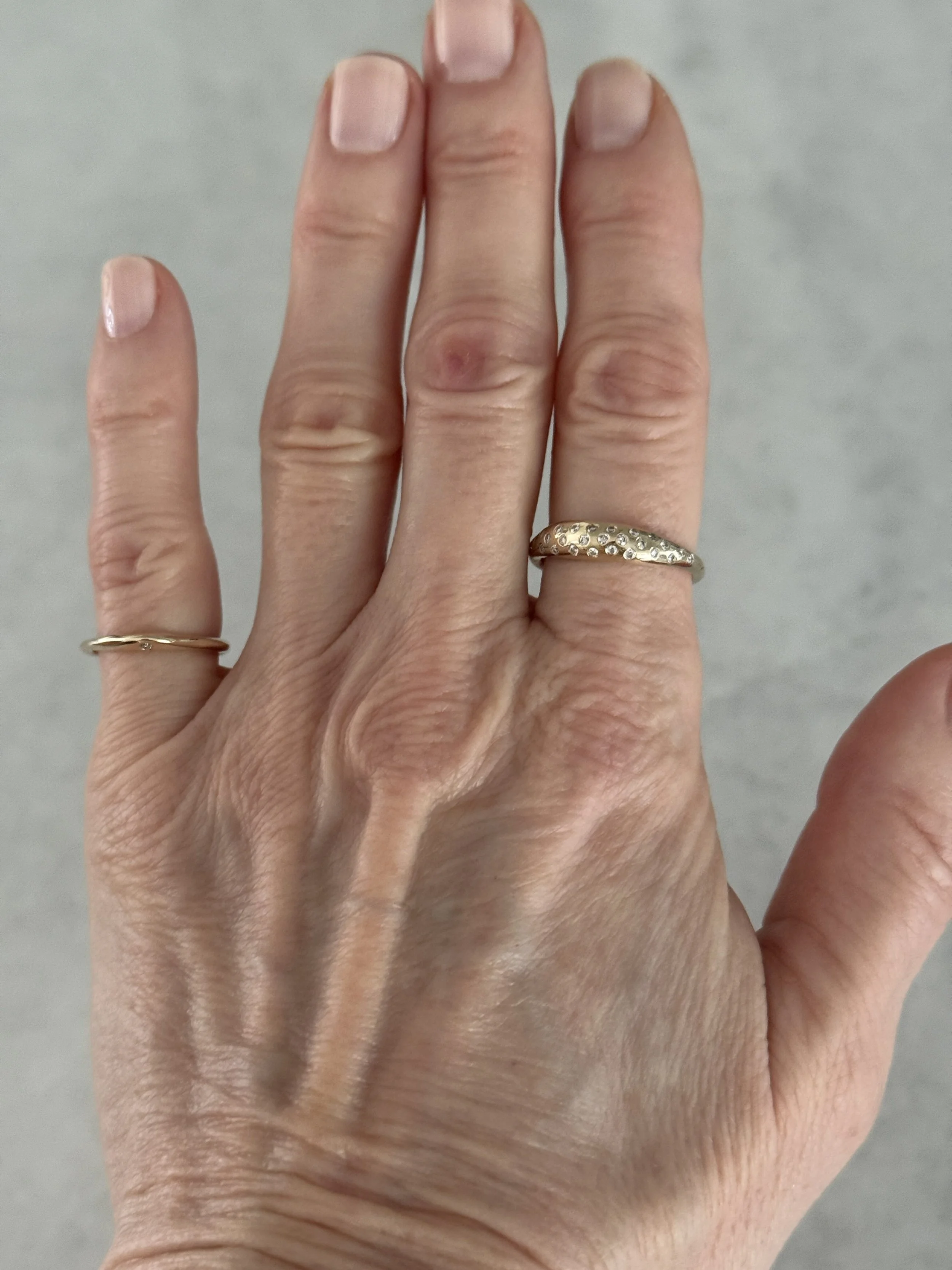 mila's custom diamond portal ring and sirius b ring