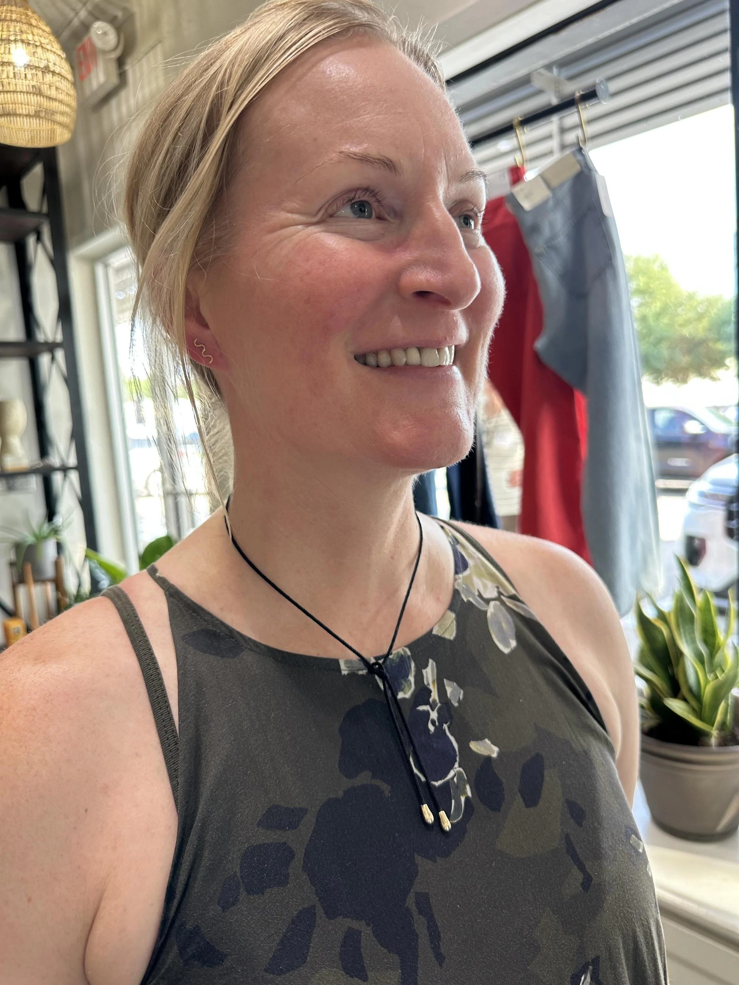 Augusta wears the Drip Silk Cord Choker and Wave Stud