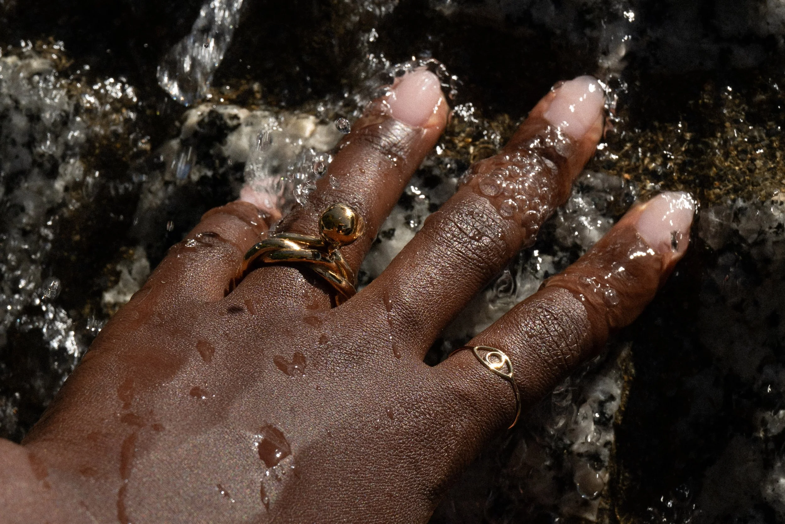 The Central Sun Ring sits next to the Helix Band, as well as the Protective Eye Shape Ring.  All handmade in 14k recycled gold.