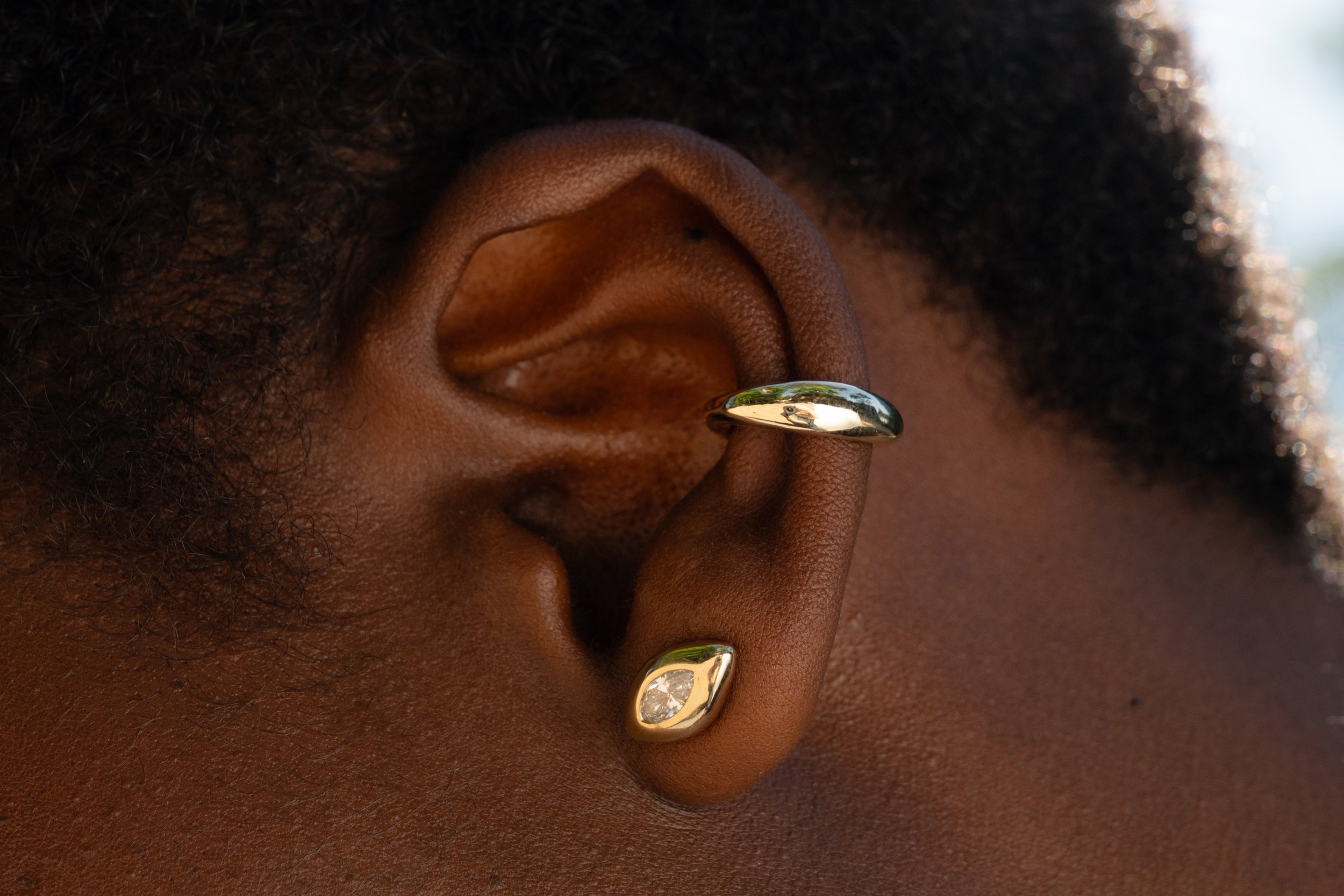 The Sibyl Ear Cuff and the Horus Stud with reclaimed marquise diamond.  Both sustainably handmade in 14k recycled gold.
