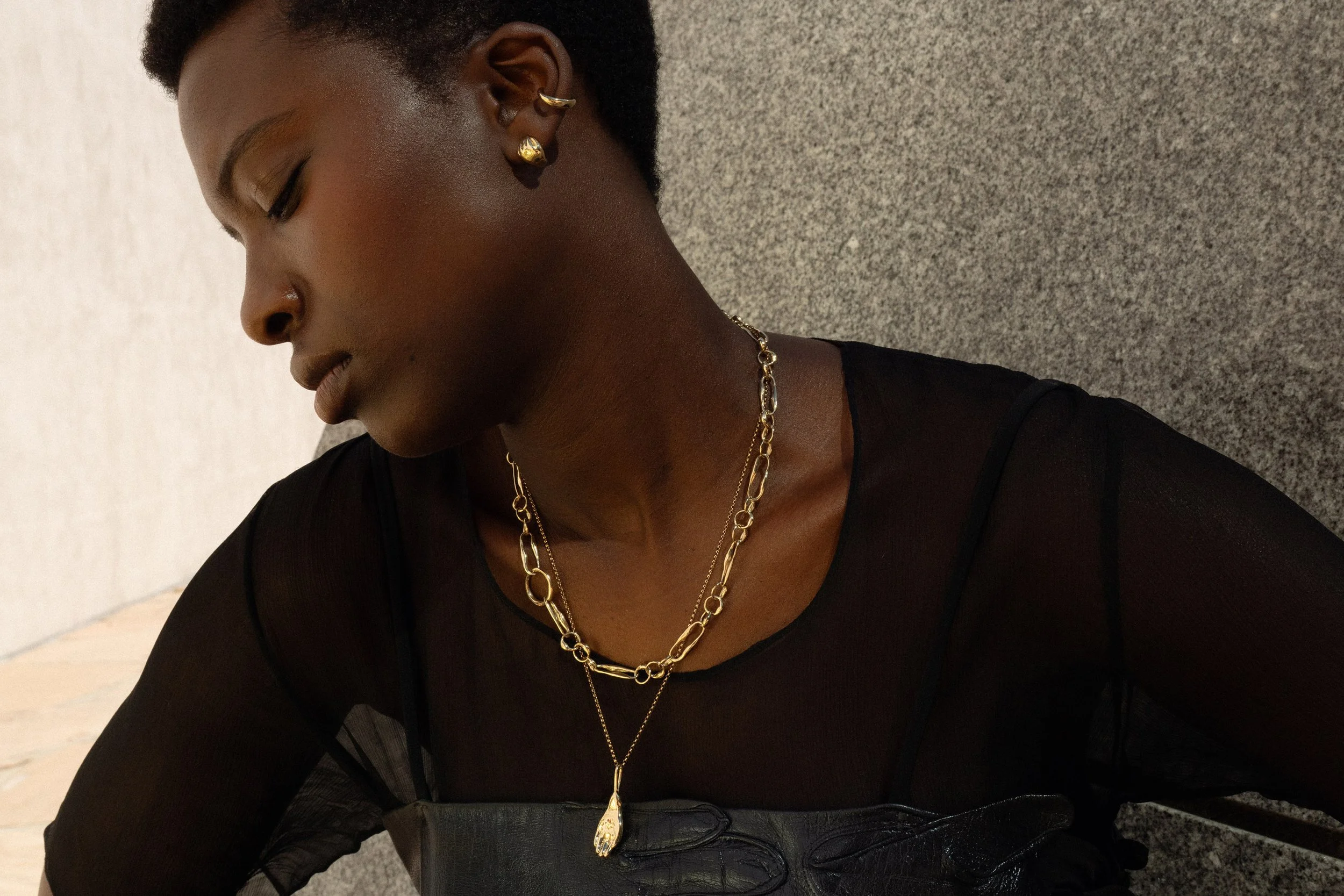 From top: Sybil Ear Cuff, Held Earrings, Metanoia Handmade Chain and the Held Necklace. Made in Denver, CO from recycled 14k gold.