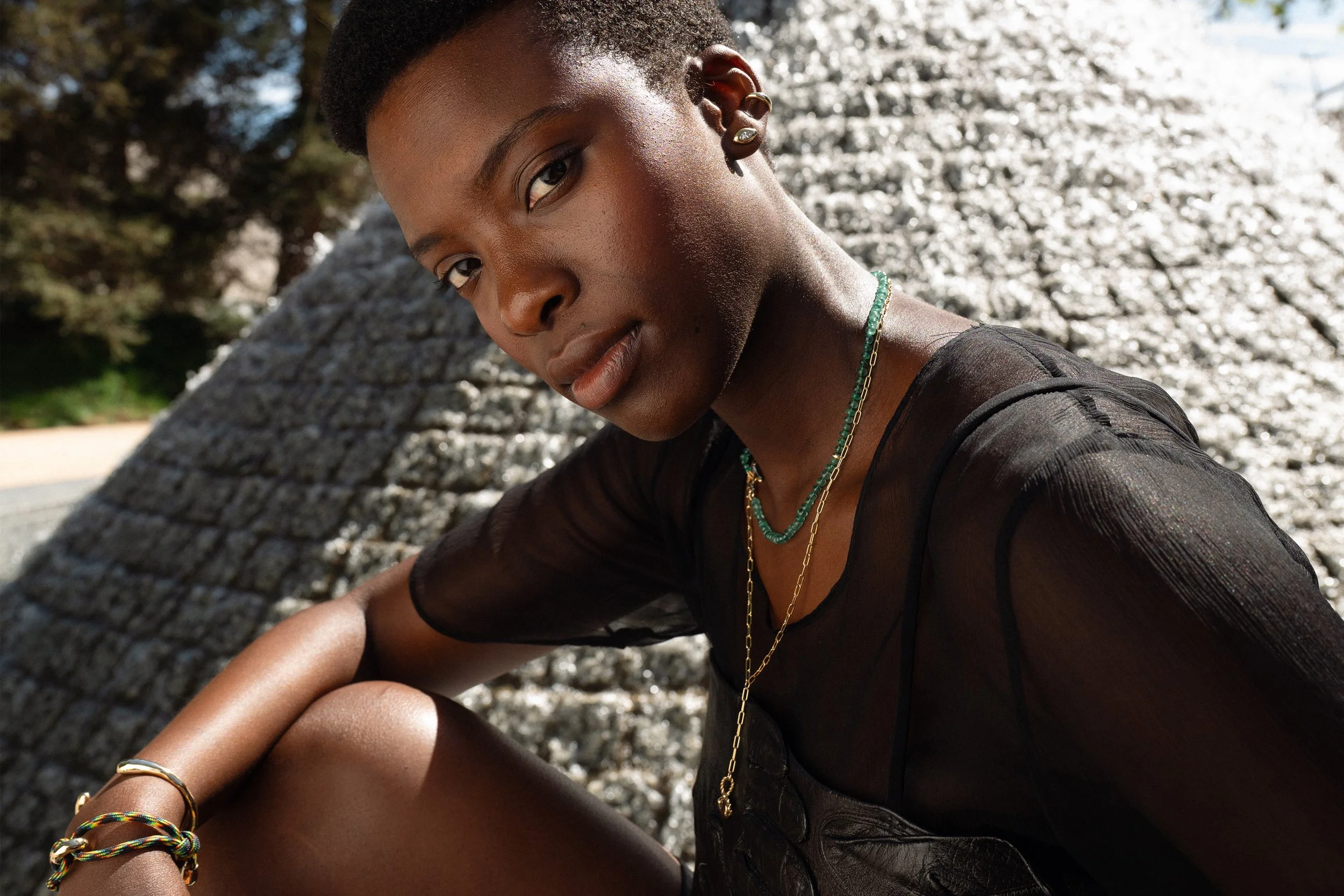 From top:  Anna wears the Sibyl Ear Cuff and marquise diamond Horus Studs, the Prayer Necklace in Emerald, the updated Protective Eye Necklace, and the Inverse Cuff and Dance Bracelet.  All handmade in recycled 14k gold.