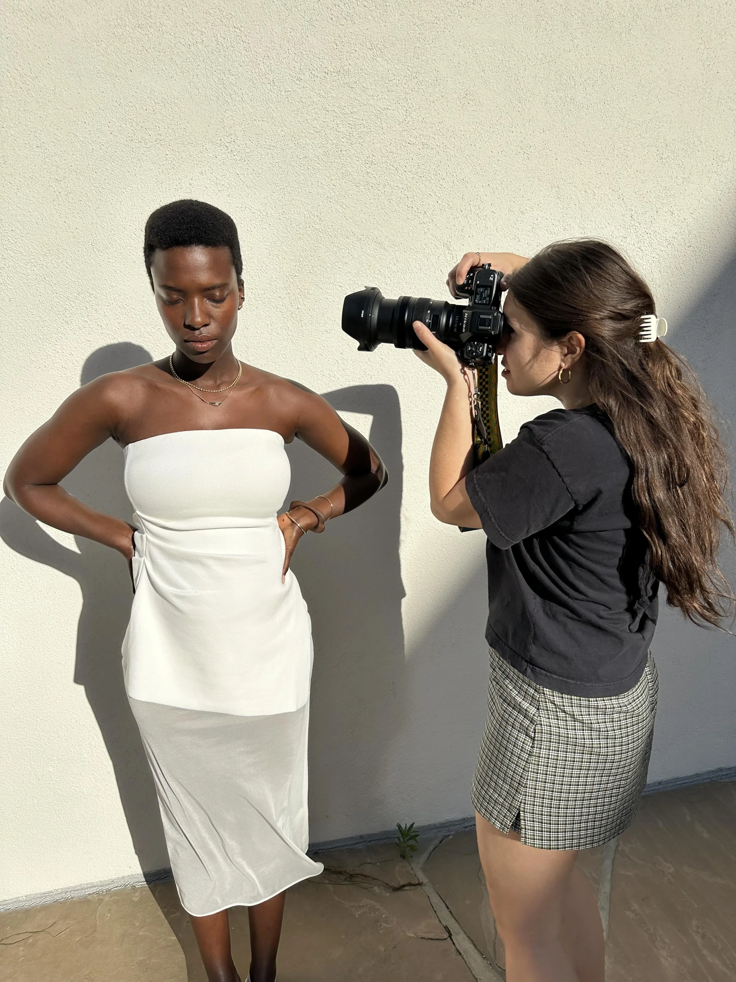 anna in the where the light comes through necklace and horus studs