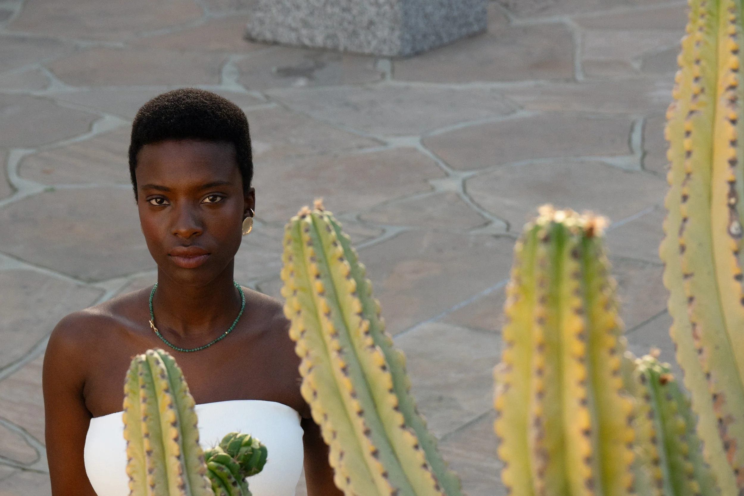 From top: the Sybil Ear Cuff, Soleil Earrings and the Prayer Necklace in Emerald. All handmade recycled 14k gold.