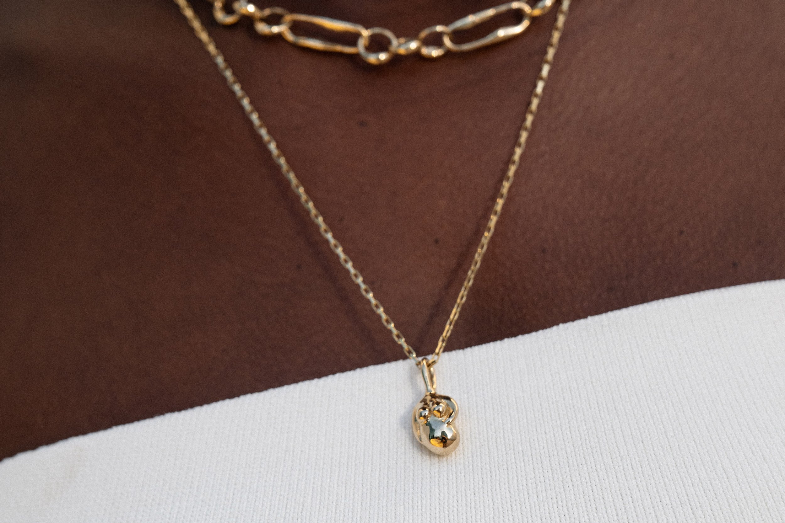 The Soft Body Venus Necklace, sustainably handmade in solid, recycled 14k gold.