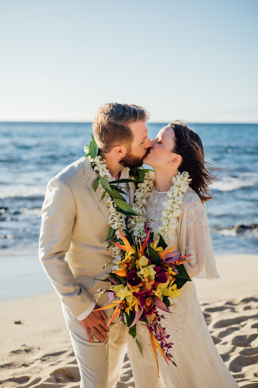 bride and groom kiss during their hawaii elopement