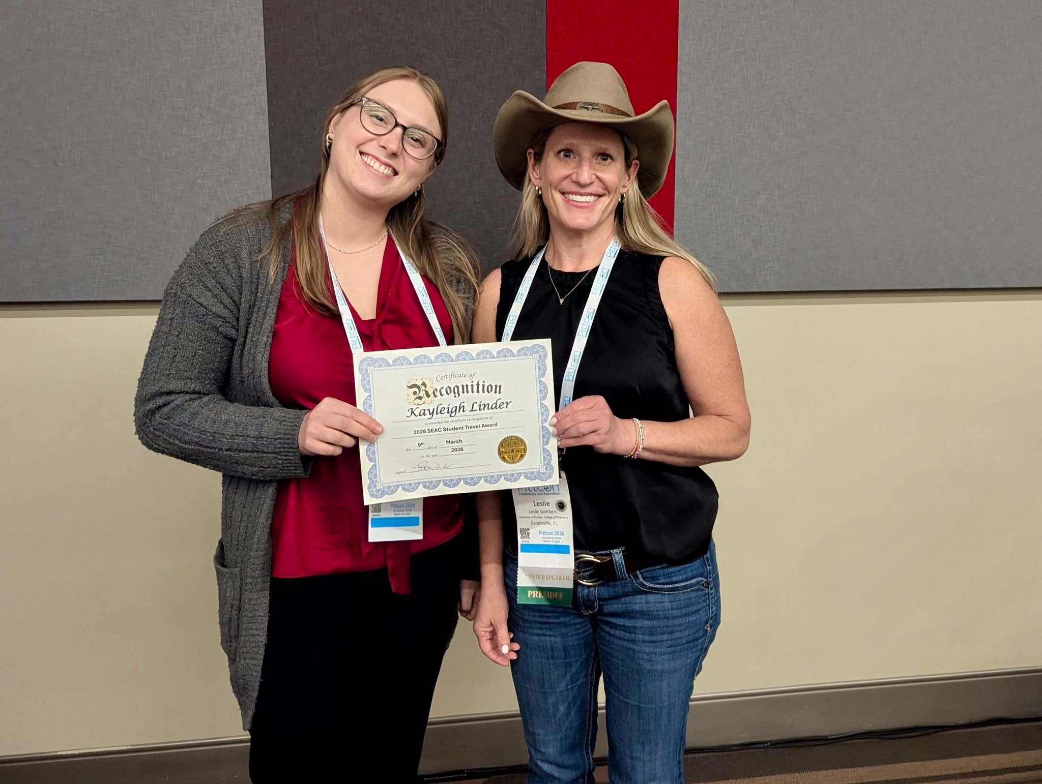 Dr. Sombers and Kayleigh Holding an award at PittCon 2026