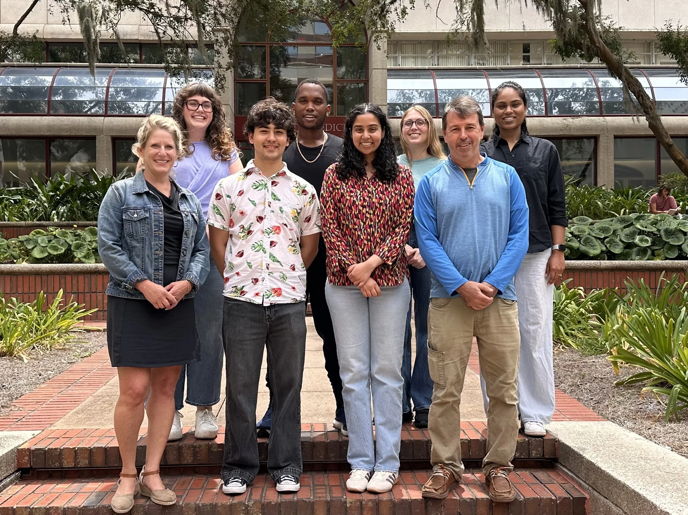  The Sombers’ Lab group photo as of Fall 2026.   Back Row: Kalynn Turner, Kemoi George, Kayleigh Linder, Dr. Dilmi Waidyaratne (From Left to Right).   Front Row: Dr. Leslie Sombers, Colin Hafdahl, Terdha Narla, Dr. Greg McCarty (From left to Right). 