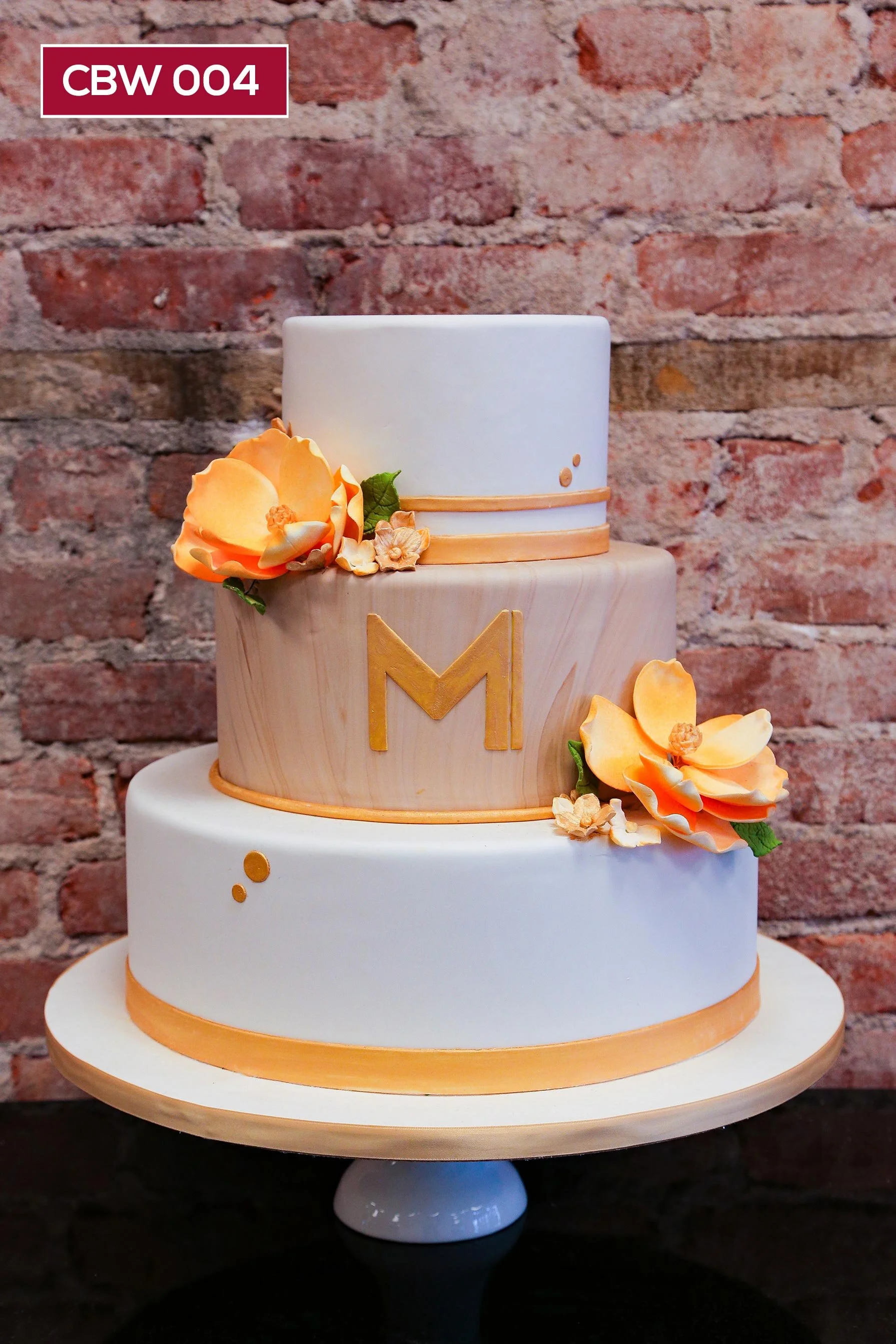 CBW004_Custom Cake_Hoboken Display_gold_wood_brown marble_peach_orange_monogram_magnolias.jpg