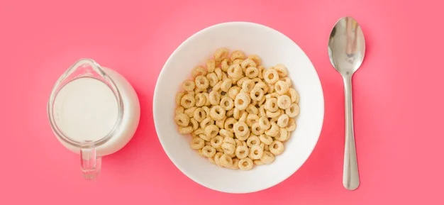 cereals-in-ceramic-bowl-with-milk-and-spoon-on-pink-backdrop_23-2147872657.jpg