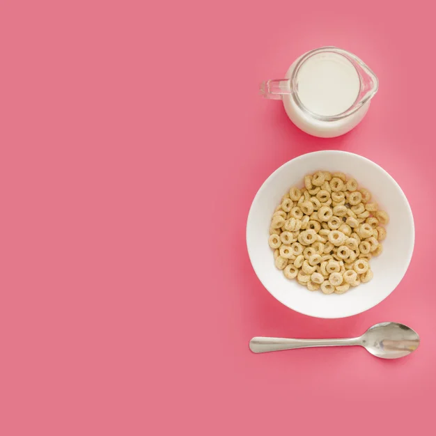 cereals-in-ceramic-bowl-with-milk-and-spoon-on-pink-backdrop_23-2147872657.jpg