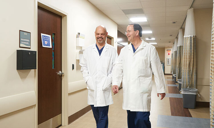 clarke and izant walking inside surgery center.jpg
