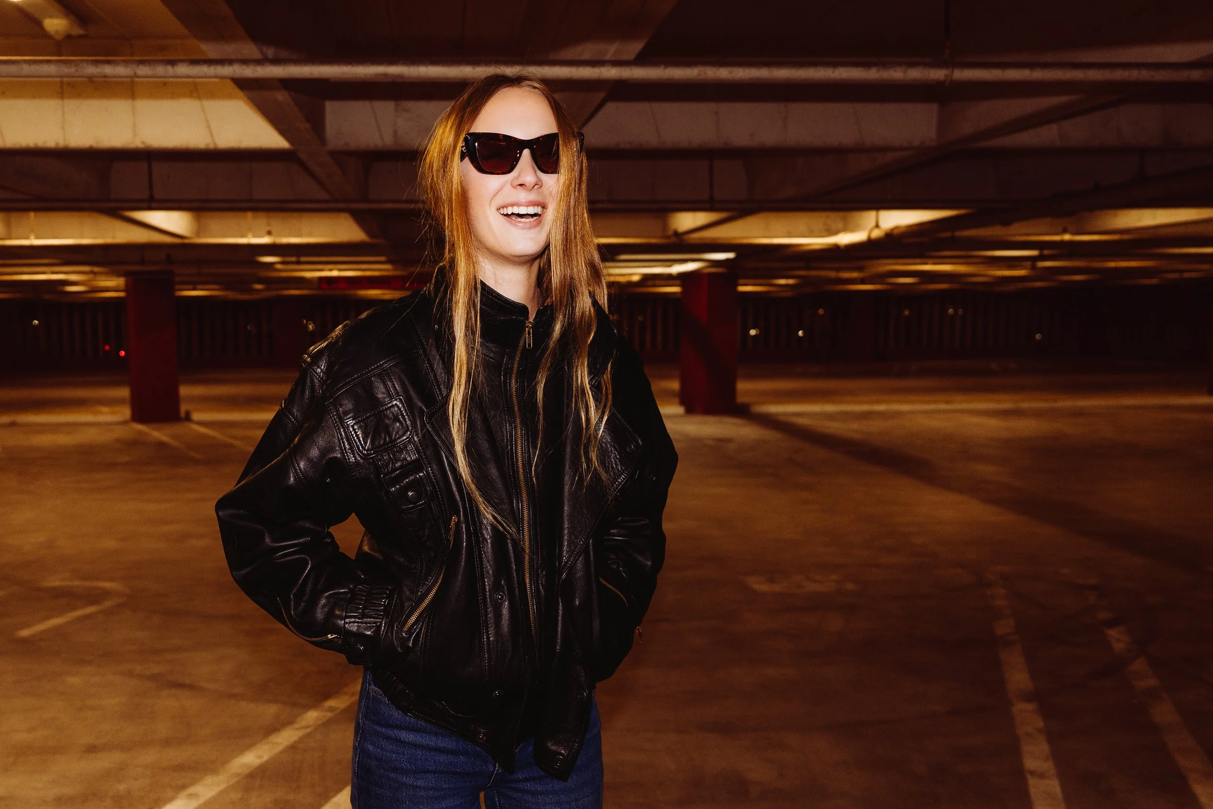 fashion model Aubrey wearing a vintage leather jacket, styling by julian castaneda and posing for an editorial fashion photo