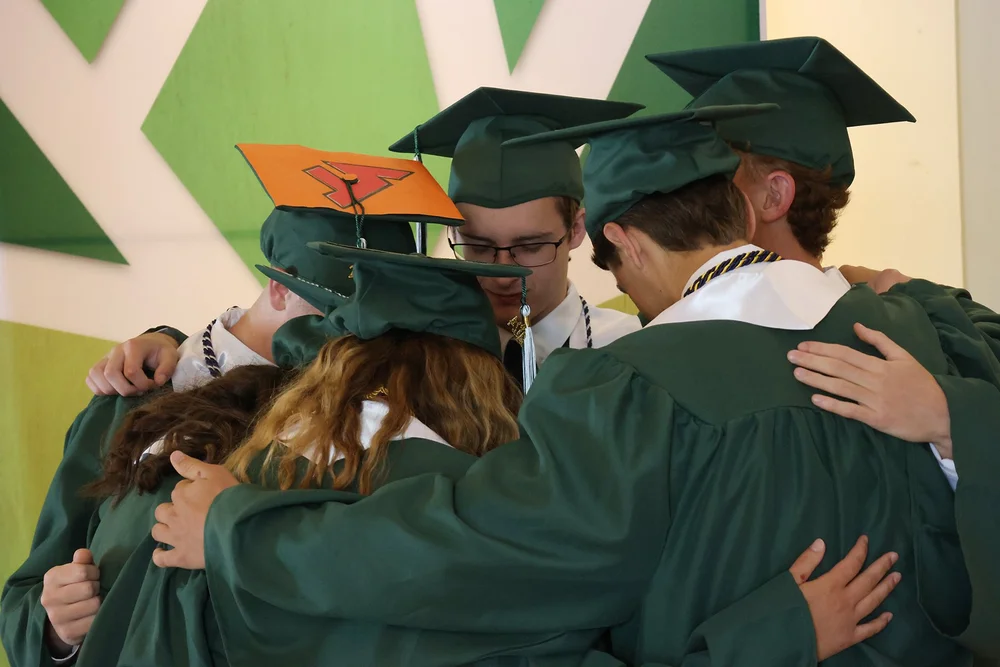 Gathering for prayer before the ceremony begins