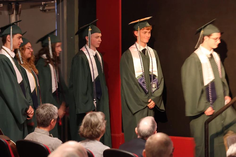 Waiting to receive their diplomas