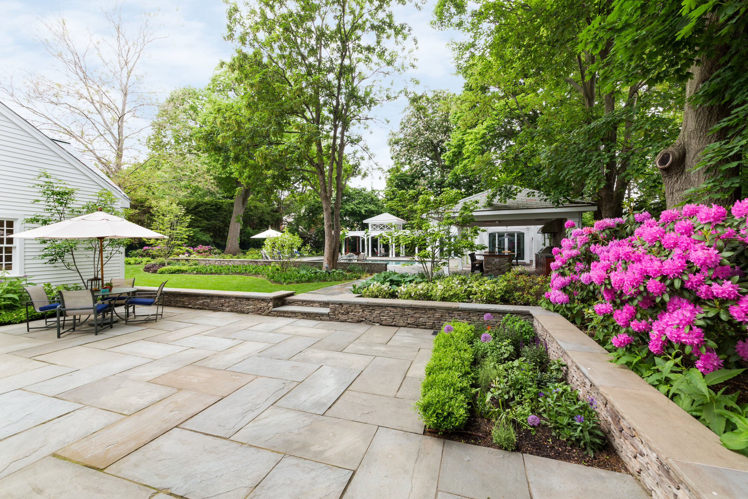 4 Landscape Design Features That Could Best Complement a Bluestone Patio in  Wellesley, MA Area