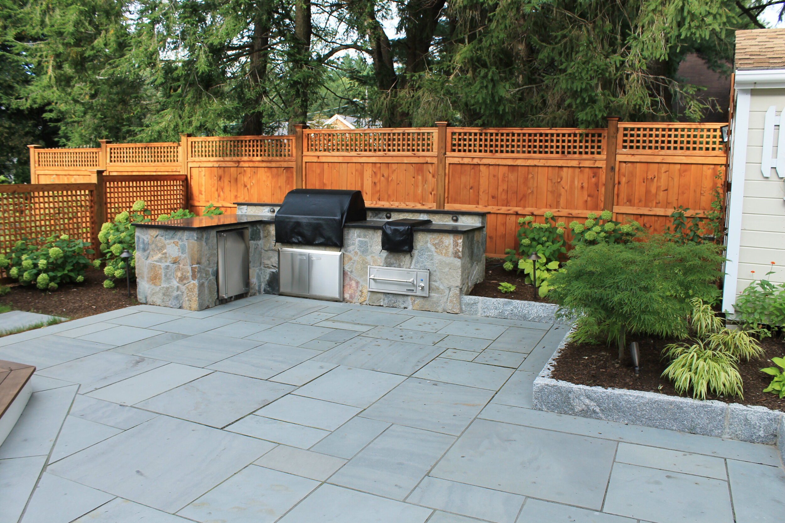 4 Landscape Design Features That Could Best Complement a Bluestone Patio in  Wellesley, MA Area