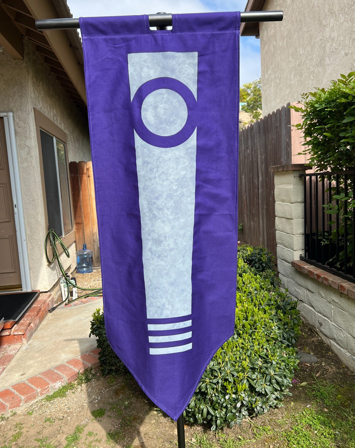 I created another banner, this time using purple twill fabric and grey paint. The symbol started as a design on my Mandalorian gauntlets that I then carried over to other pieces of my armor. Now I have a banner. 

#mandagalaar #mmcc #mandagalaarbanne